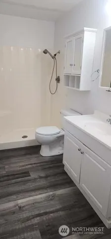a bathroom with a toilet and a sink