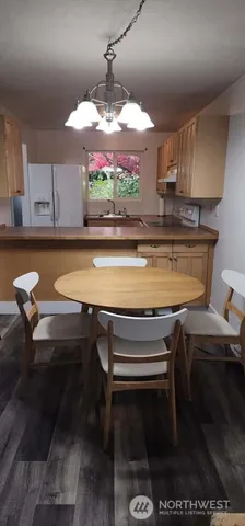 a kitchen with a stove and a table