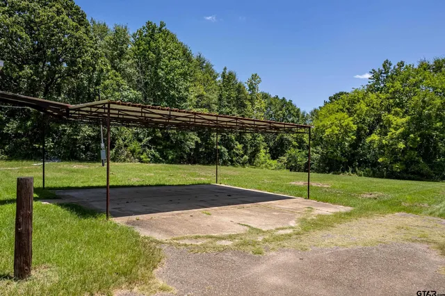 a view of swimming pool with an outdoor space and seating area