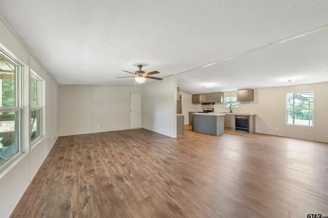a view of a kitchen with a stove cabinets and wooden floor