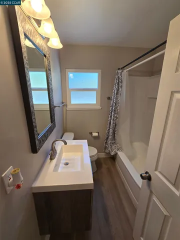 a bathroom with a sink a mirror and a shower