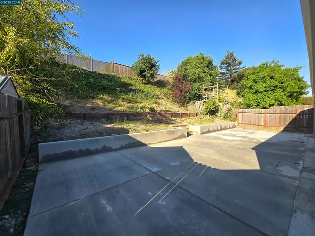 a view of a swimming pool with an outdoor space and seating area