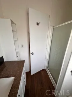 a view of front door with wooden floor