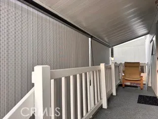 a view of a balcony with furniture