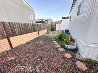 a view of a backyard with sitting area