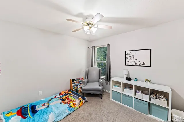 a bedroom with furniture and a window