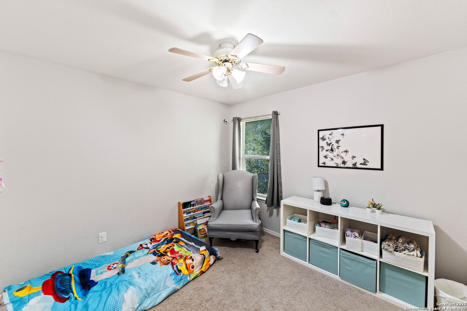 10611 Apple Spring Universal City, TX 78148 - Photo 13 of 29 a bedroom with furniture and a window
