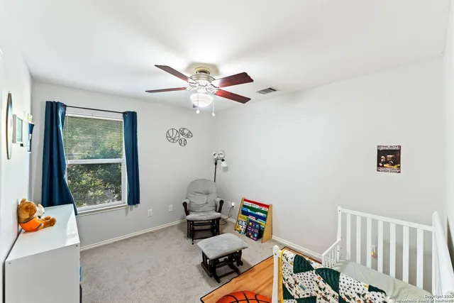 a bedroom with furniture and a window