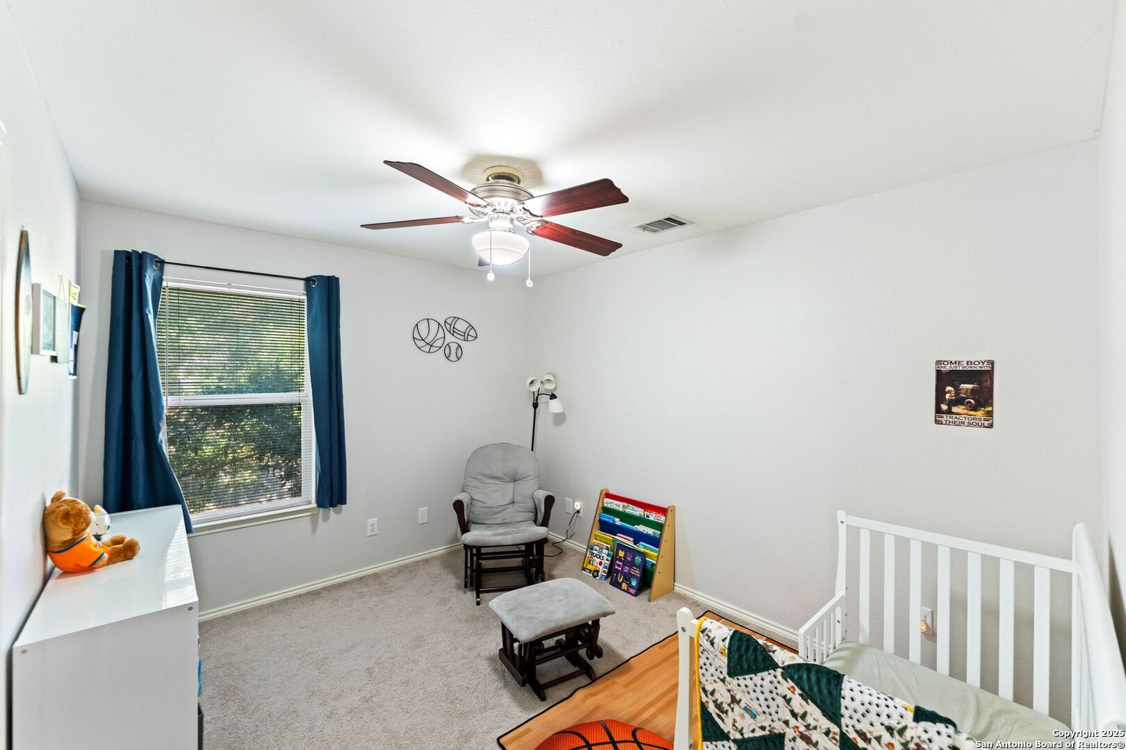 10611 Apple Spring Universal City, TX 78148 - Photo 15 of 29 a bedroom with furniture and a window