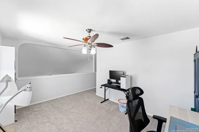 a view of a workspace with furniture