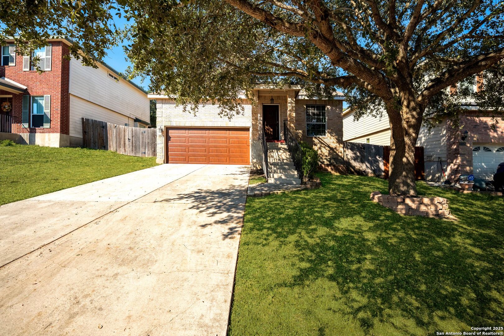 10611 Apple Spring Universal City, TX 78148 - Photo 2 of 29 a view of a yard with plants and tree