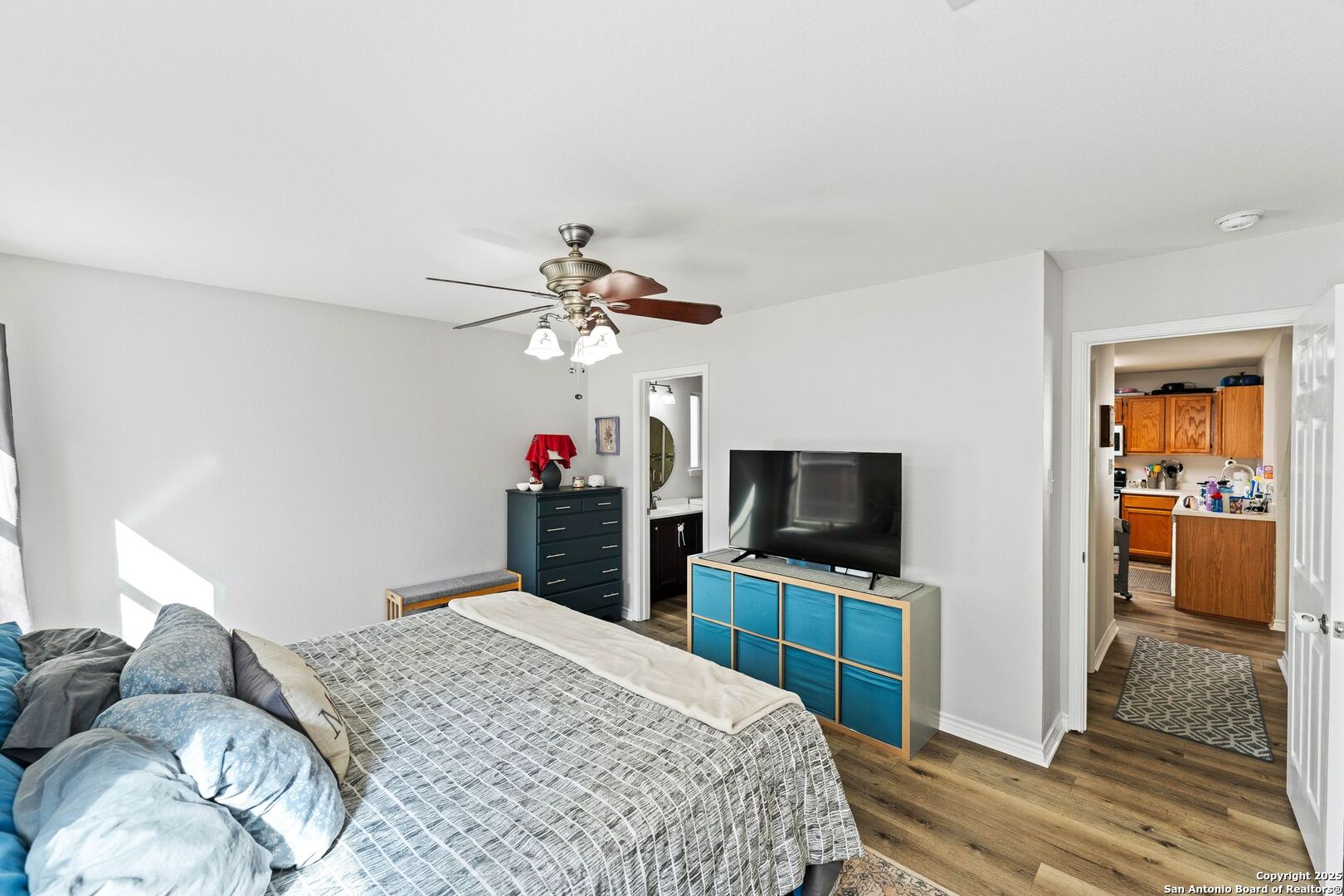 10611 Apple Spring Universal City, TX 78148 - Photo 22 of 29 a bedroom with a bed and a flat screen tv