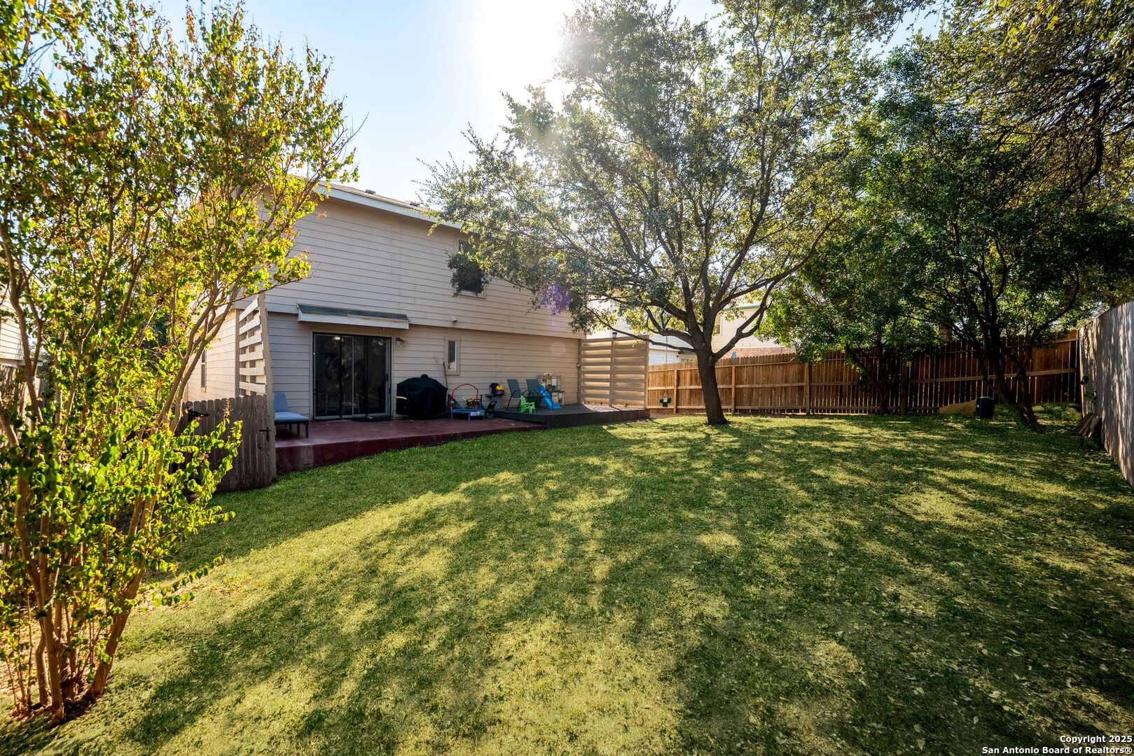 10611 Apple Spring Universal City, TX 78148 - Photo 27 of 29 a view of a house with backyard and a tree