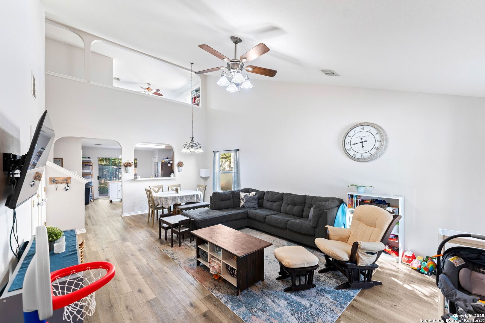 10611 Apple Spring Universal City, TX 78148 - Photo 4 of 29 a living room with furniture a rug and a chandelier