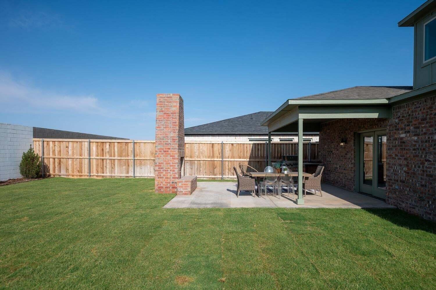 3617 128th Street Lubbock, TX 79423 - Photo 28 of 30 a view of a backyard with table and chairs and potted plants
