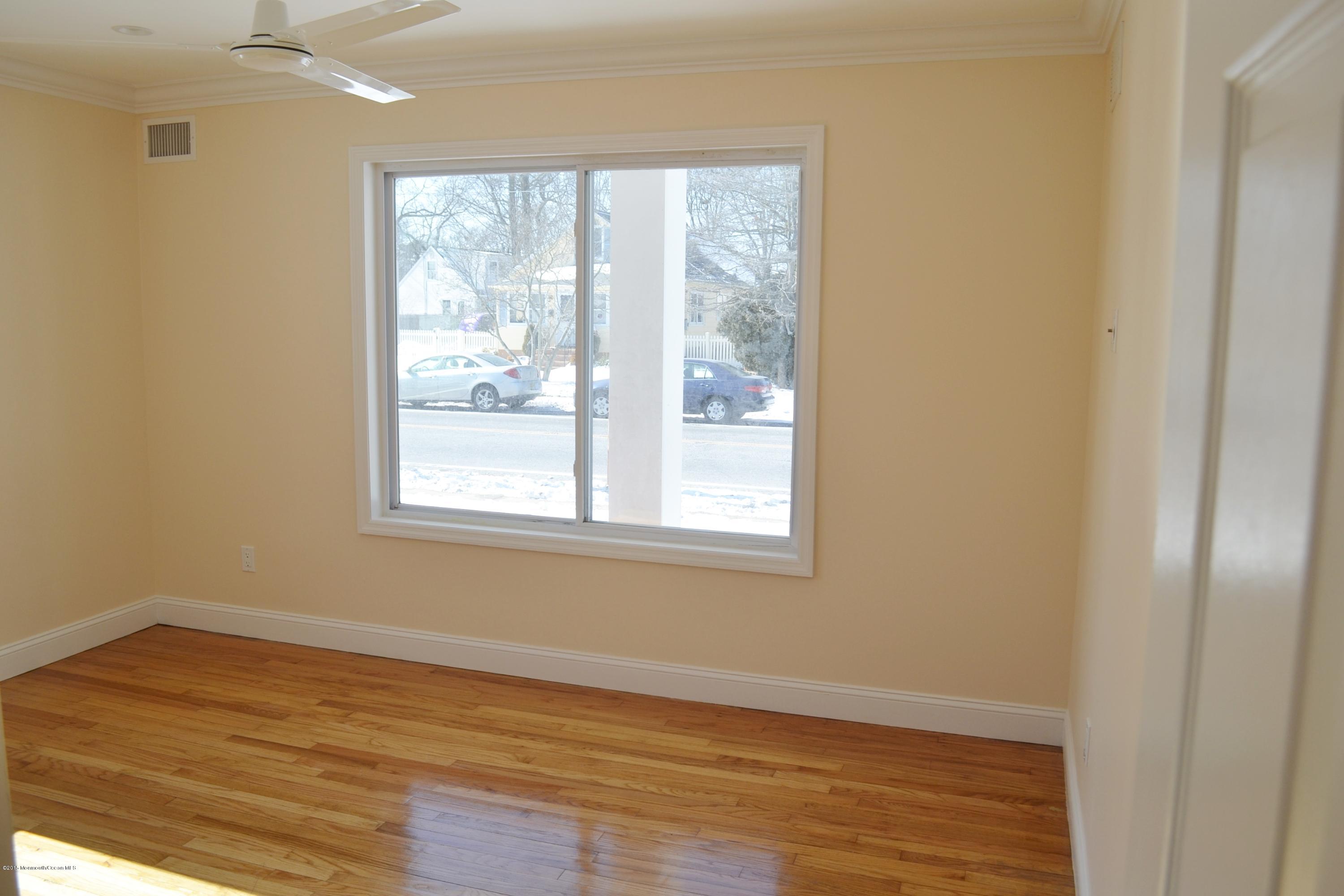 1000 Beaver Dam Road Point Pleasant, NJ 08742 - Photo 13 of 32 a view of an empty room with wooden floor and a window