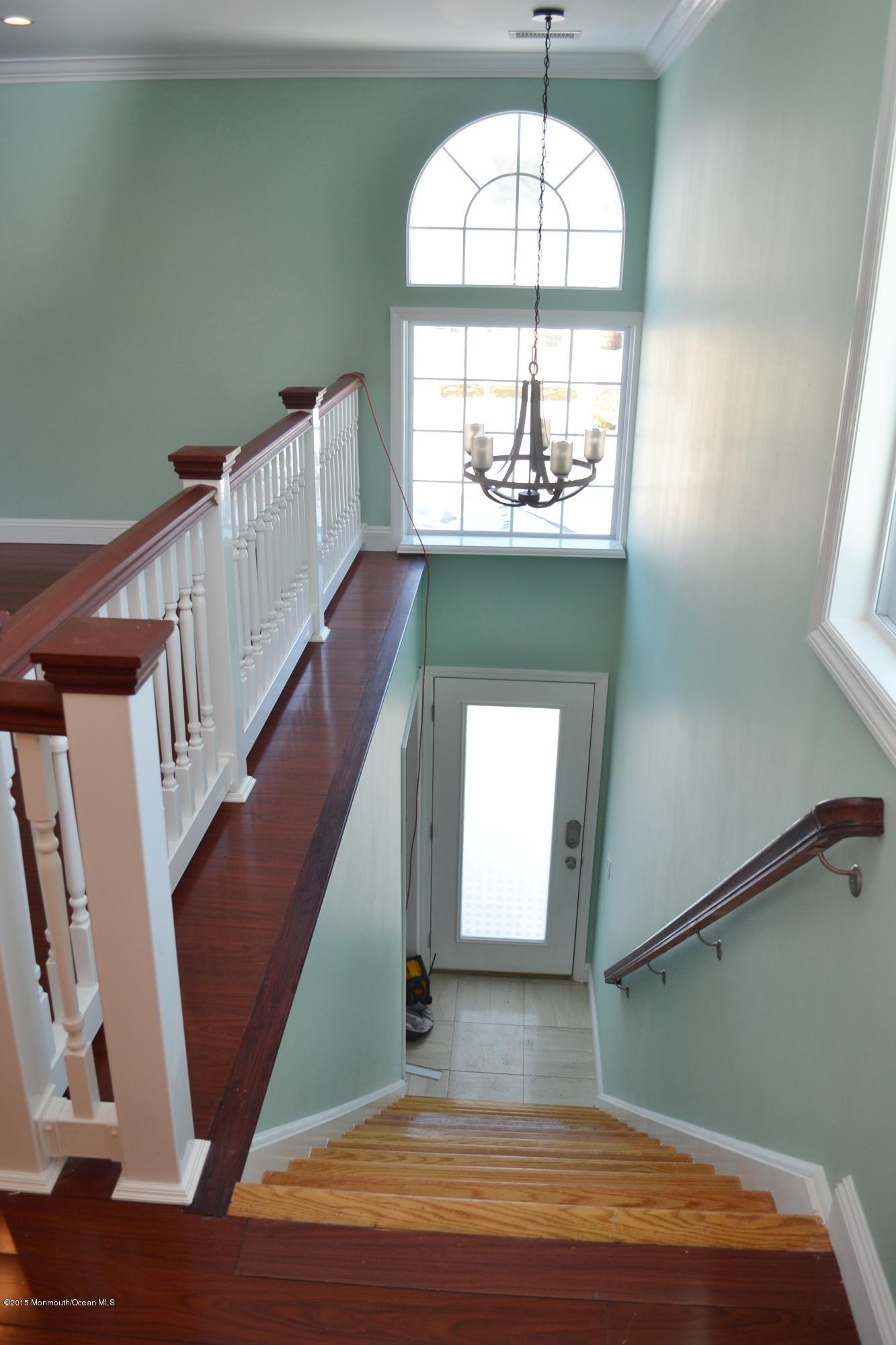 1000 Beaver Dam Road Point Pleasant, NJ 08742 - Photo 17 of 32 a view of a livingroom with wooden floor and stairs
