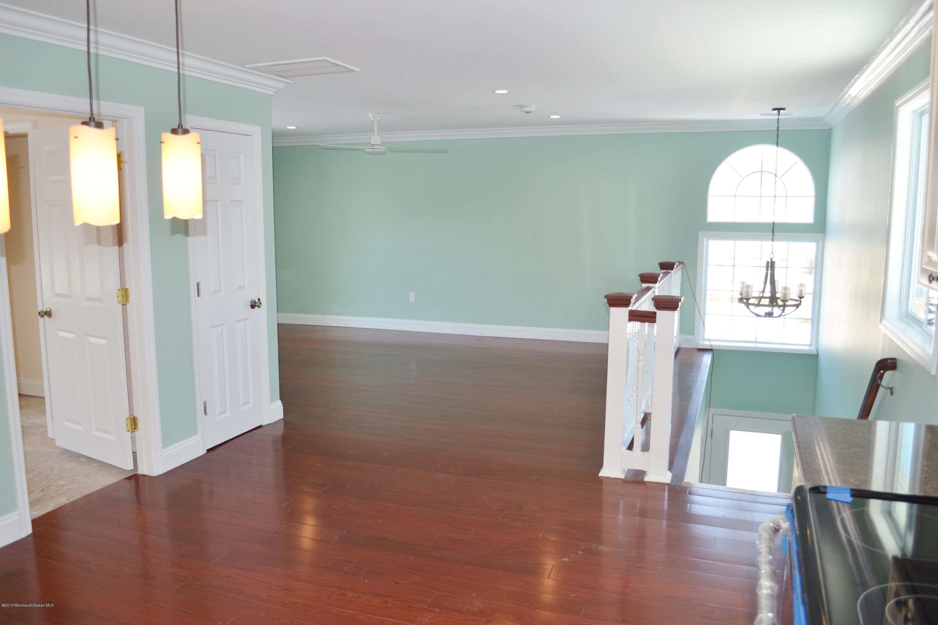 1000 Beaver Dam Road Point Pleasant, NJ 08742 - Photo 19 of 32 a view of a room with wooden floor and cabinet