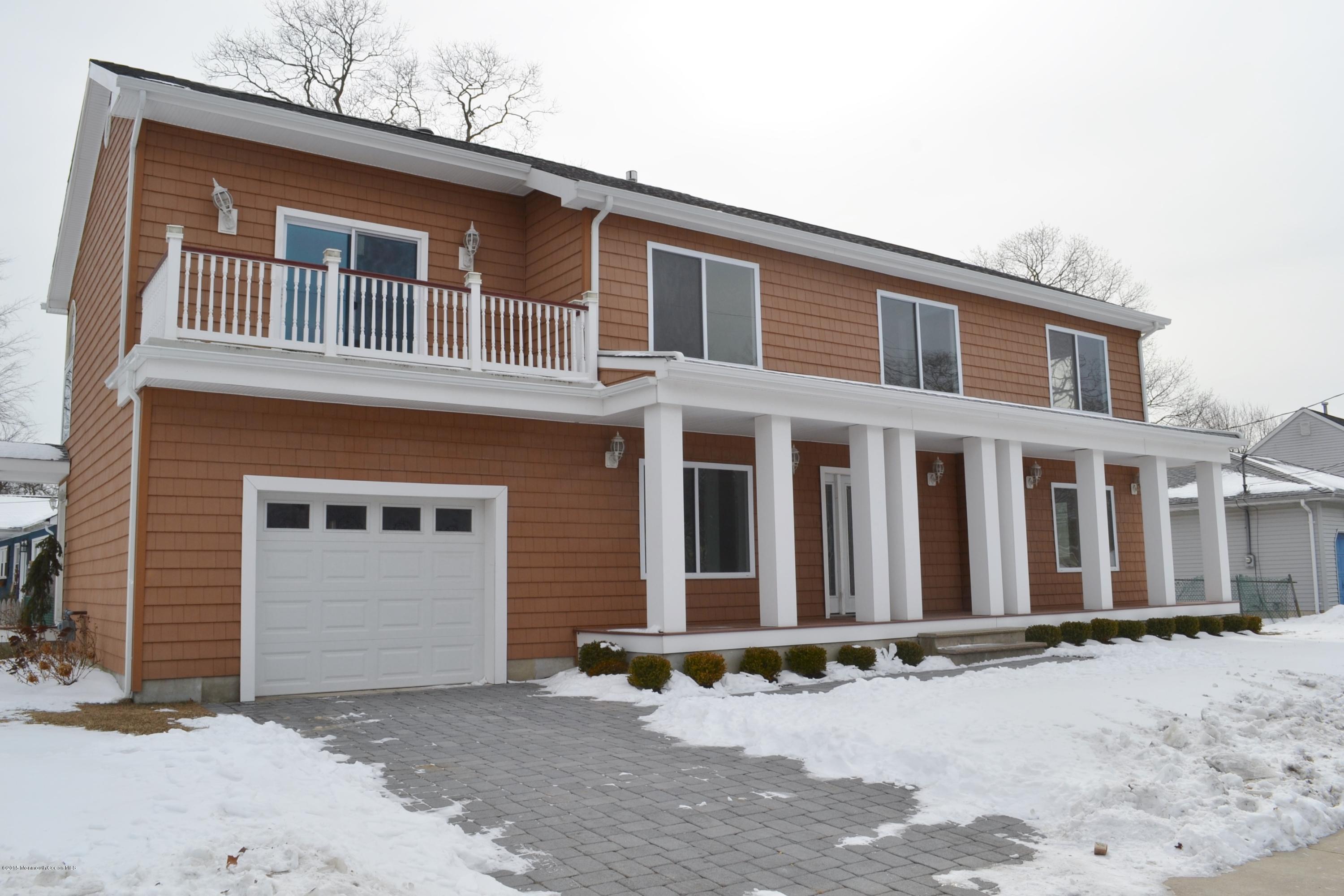 1000 Beaver Dam Road Point Pleasant, NJ 08742 - Photo 2 of 32 a front view of a house with a yard