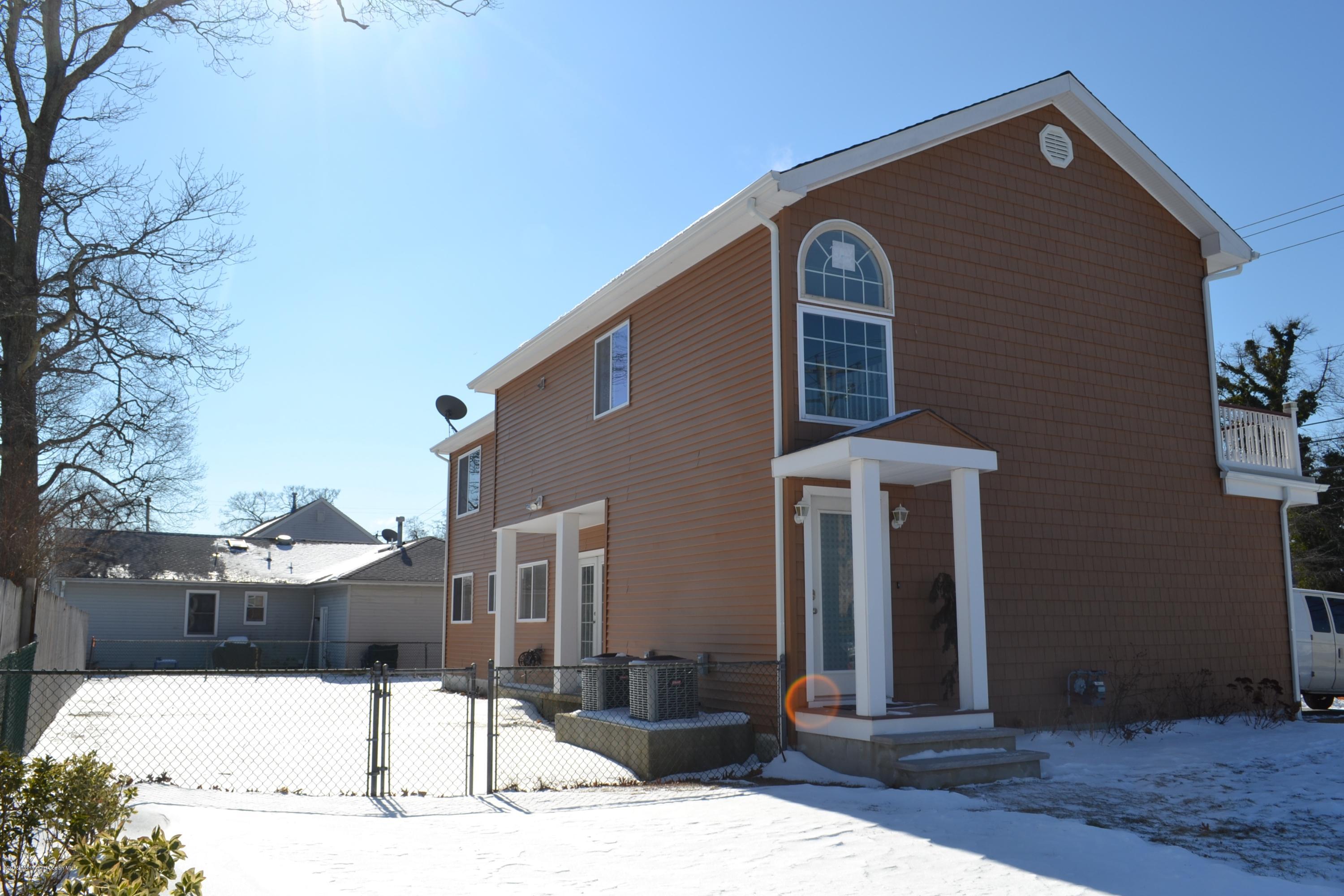1000 Beaver Dam Road Point Pleasant, NJ 08742 - Photo 30 of 32 a front view of a house with parking