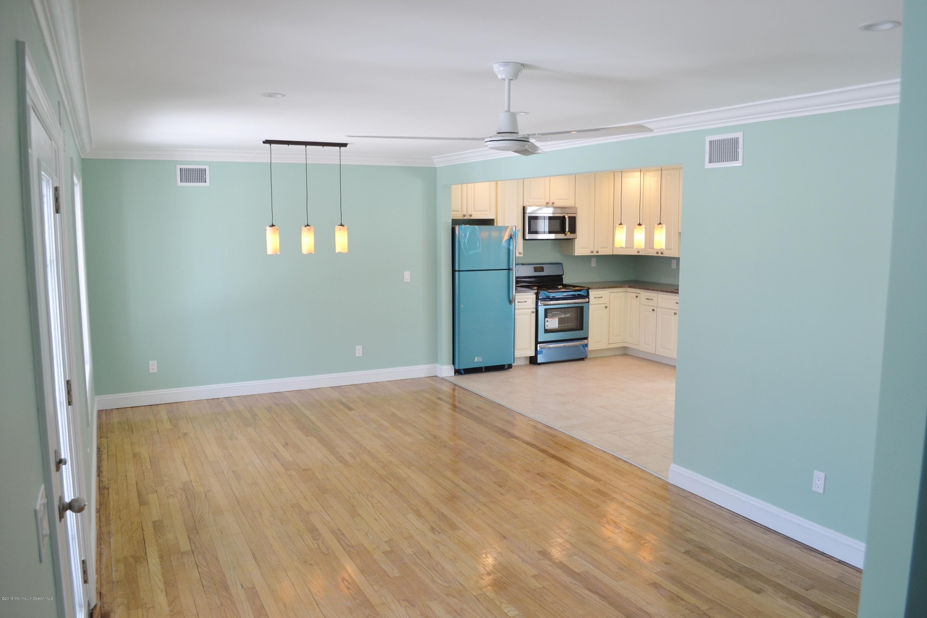 1000 Beaver Dam Road Point Pleasant, NJ 08742 - Photo 6 of 32 a view of a kitchen with a sink and dishwasher a refrigerator with wooden floor