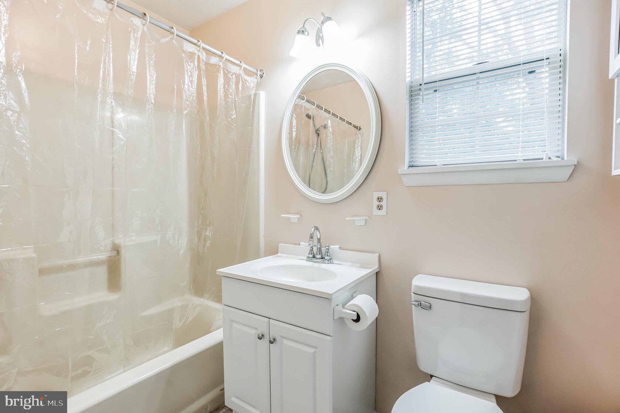 526 Maple Way Lusby, MD 20657 - Photo 20 of 26 a bathroom with a sink toilet and shower