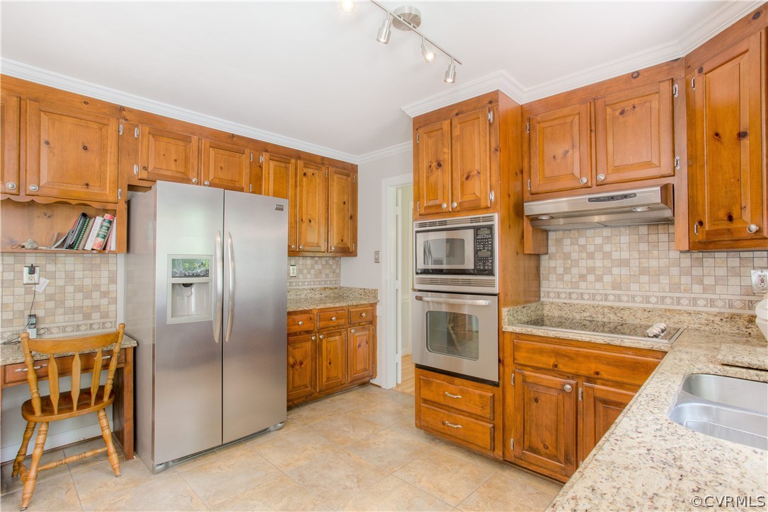 13641 Glendower Road Midlothian, VA 23113 - Photo 13 of 38 a kitchen with stainless steel appliances granite countertop a refrigerator a stove and a sink with wooden cabinets