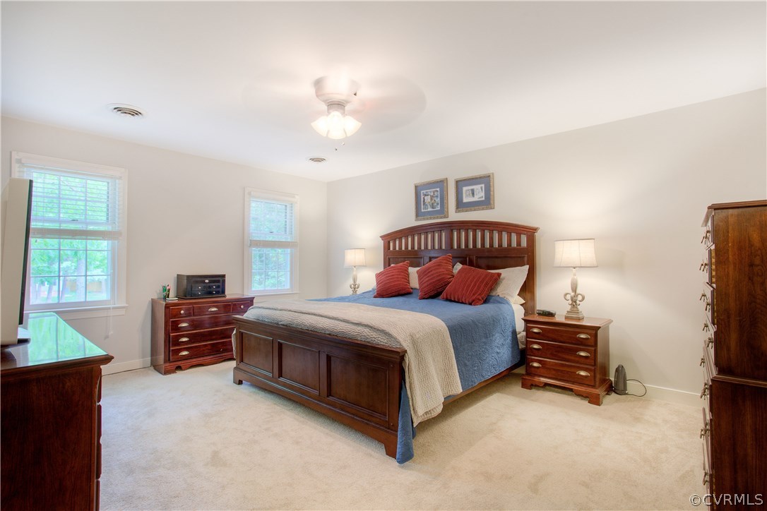 13641 Glendower Road Midlothian, VA 23113 - Photo 24 of 38 a bedroom with a bed and a chandelier