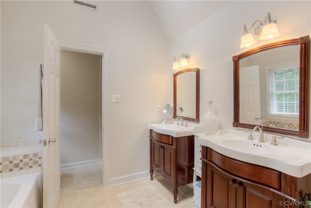 13641 Glendower Road Midlothian, VA 23113 - Photo 26 of 38 a bathroom with a sink and a mirror