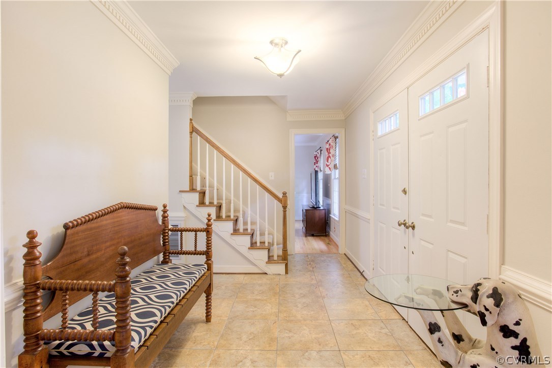 13641 Glendower Road Midlothian, VA 23113 - Photo 5 of 38 a view of a livingroom with wooden floor and a chandelier