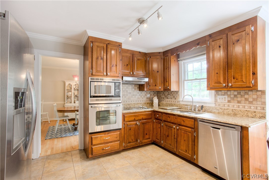 13641 Glendower Road Midlothian, VA 23113 - Photo 10 of 38 a kitchen with stainless steel appliances granite countertop a refrigerator and cabinets