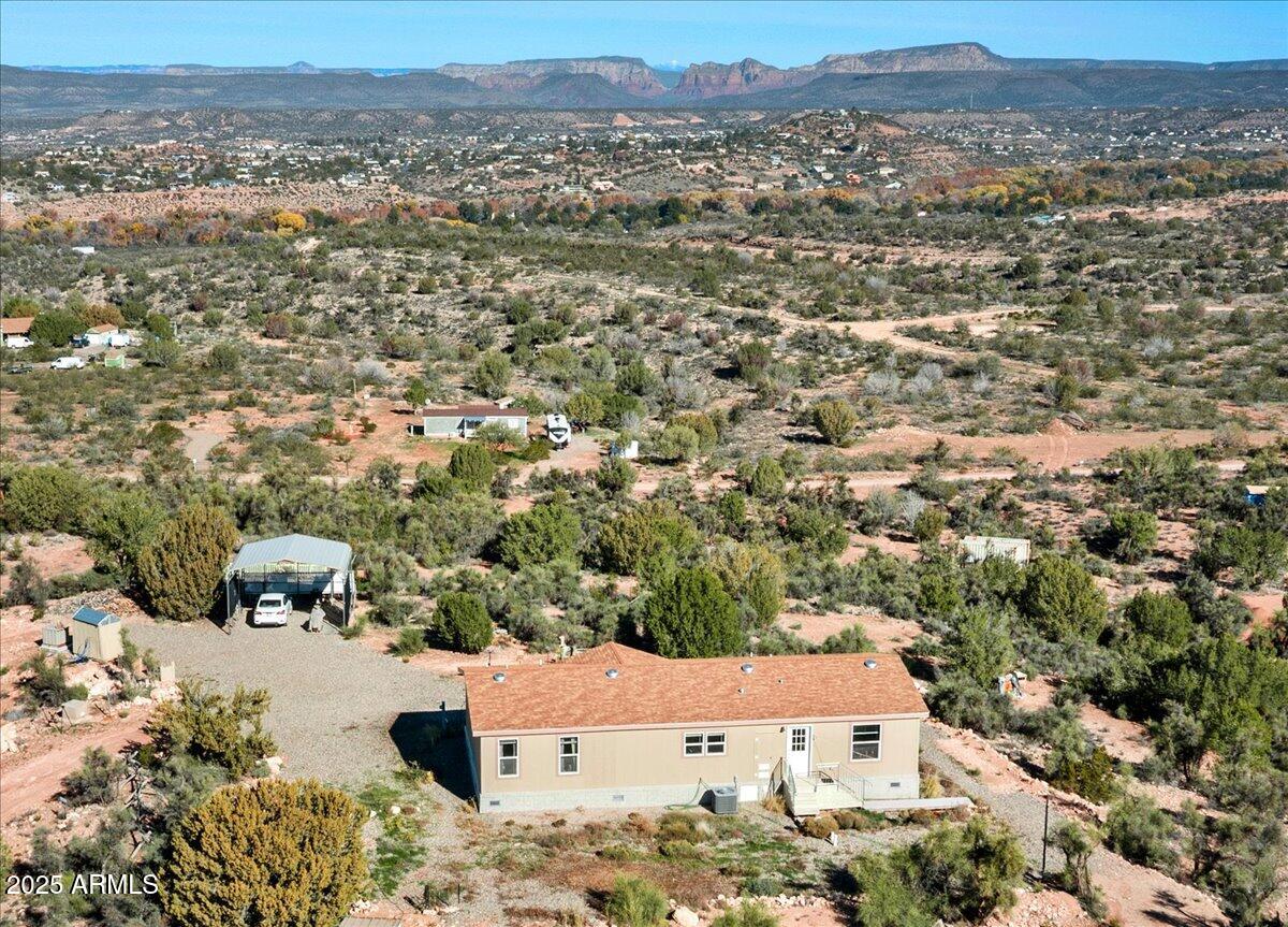 an aerial view of residential houses with outdoor space