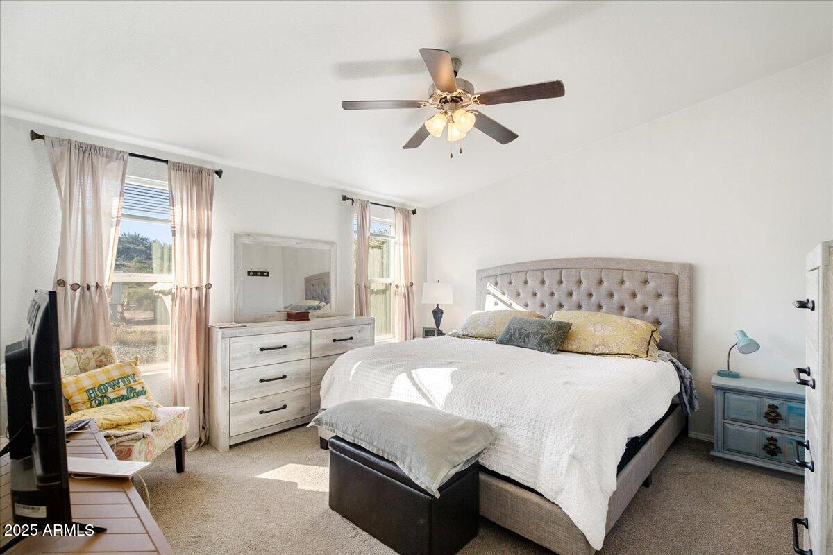 3145 Fort Verde Trail Rimrock, AZ 86335 - Photo 7 of 12 a bedroom with a bed and a window