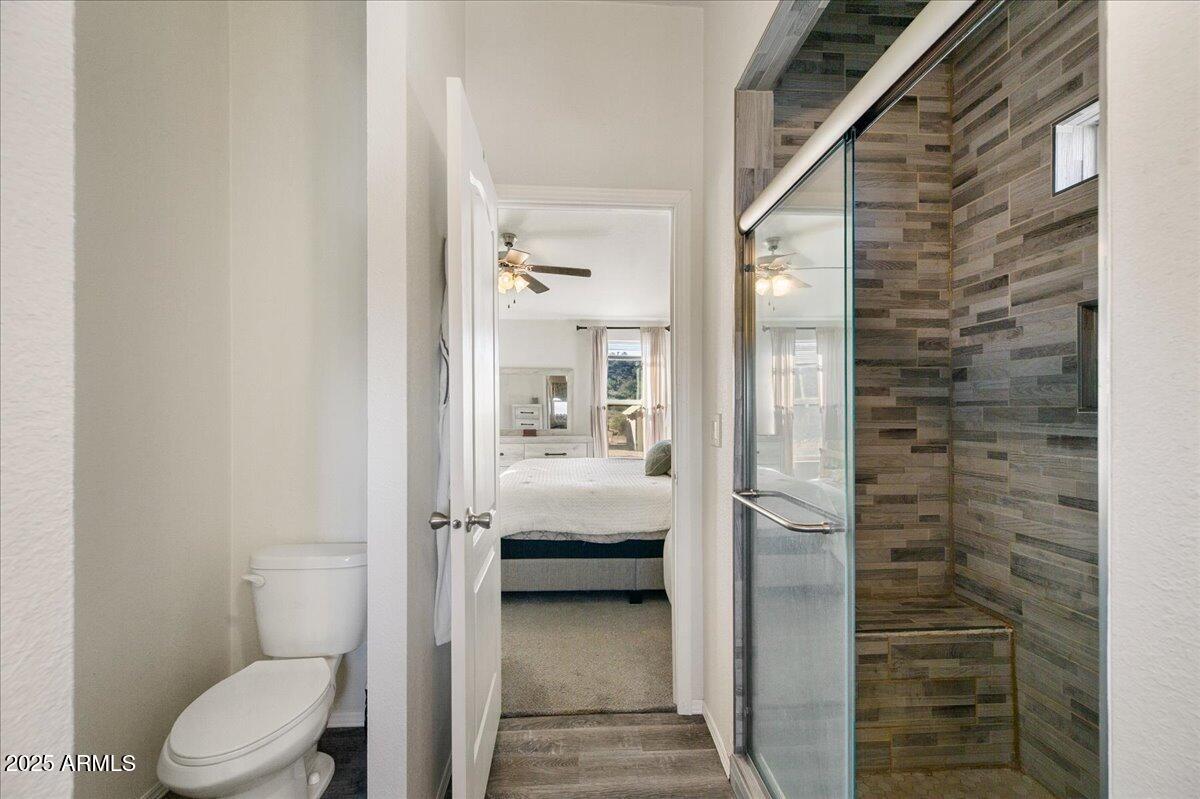 3145 Fort Verde Trail Rimrock, AZ 86335 - Photo 8 of 12 a bathroom with a toilet and a shower