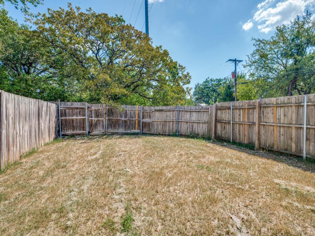 2325 Donalee Street, Unit 2325 Fort Worth, TX 76105 - Photo 12 of 13 a view of a backyard with wooden fence