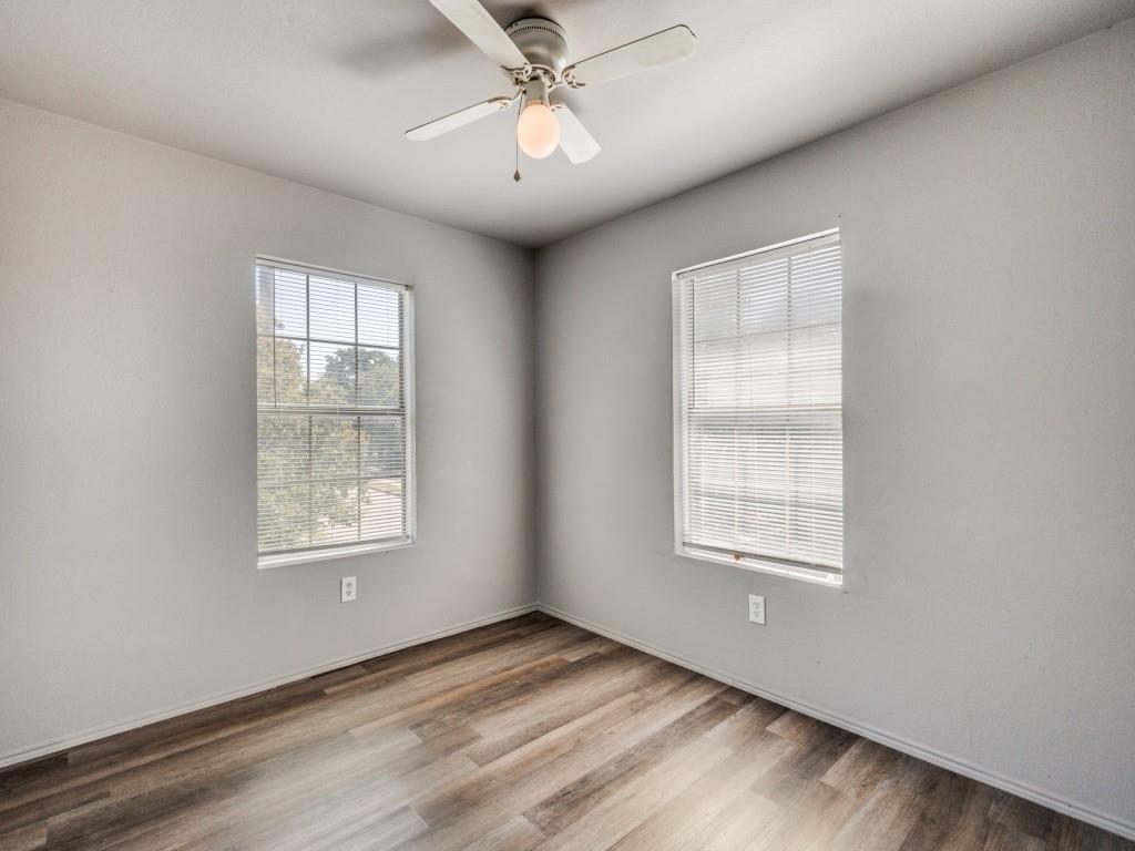 2325 Donalee Street, Unit 2325 Fort Worth, TX 76105 - Photo 5 of 13 an empty room with windows and fan