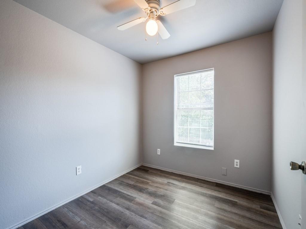 2325 Donalee Street, Unit 2325 Fort Worth, TX 76105 - Photo 10 of 13 a view of an empty room with wooden floor and a window