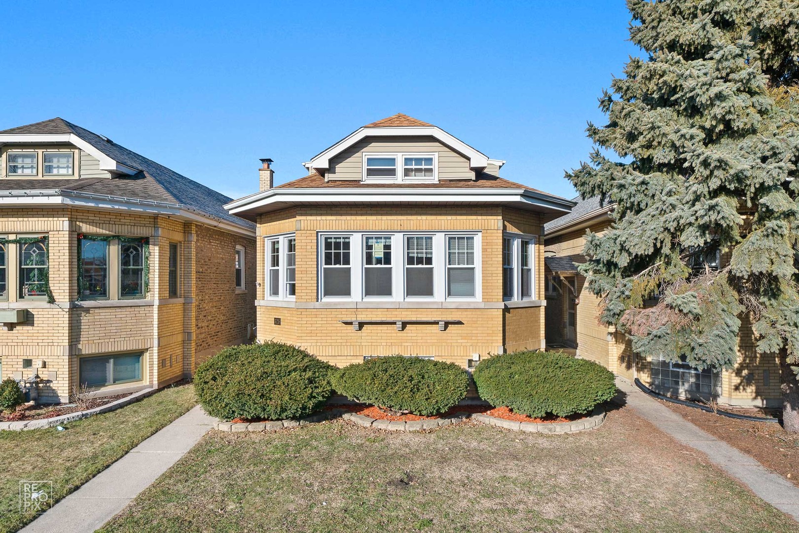 3726 Home Avenue, Unit 2 Berwyn, IL 60402 - Photo 1 of 7 a front view of a house with a yard