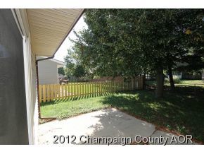 1907 Branch Road Champaign, IL 61821 - Photo 2 of 20 a view of a fence in front of a house with a small yard
