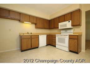 1907 Branch Road Champaign, IL 61821 - Photo 14 of 20 a kitchen with a stove a sink and a refrigerator
