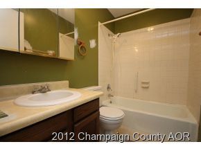 1907 Branch Road Champaign, IL 61821 - Photo 5 of 20 a bathroom with a granite countertop sink a mirror and a bathtub