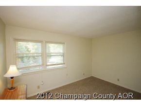 1907 Branch Road Champaign, IL 61821 - Photo 7 of 20 a view of an empty room and a window