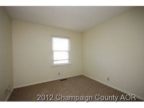 1907 Branch Road Champaign, IL 61821 - Photo 8 of 20 an empty room with a window