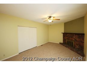 1907 Branch Road Champaign, IL 61821 - Photo 10 of 20 an empty room with a fireplace