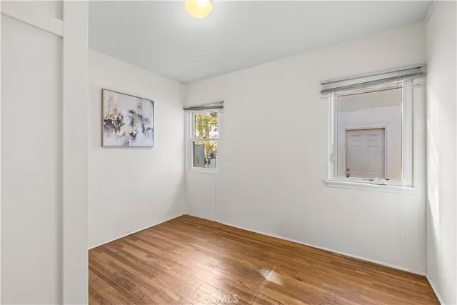 a bathroom with a granite countertop shower a sink and a mirror