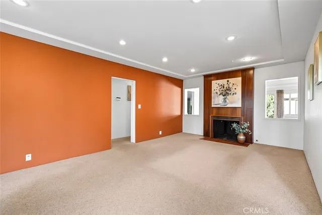 a view of a livingroom with furniture and a fireplace