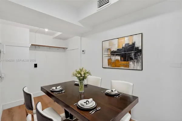 a kitchen with stainless steel appliances a sink a stove and a refrigerator