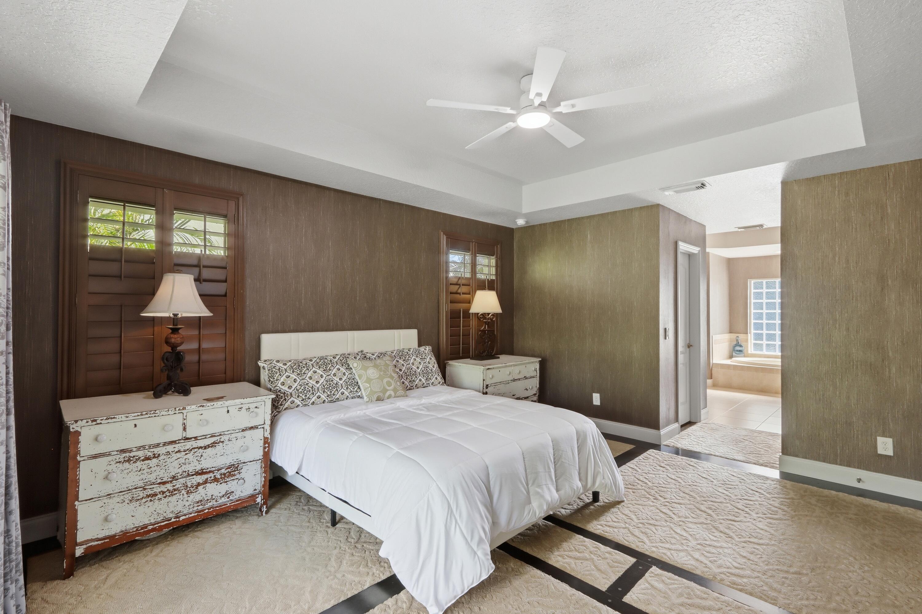 4432 Southwest Paley Road Port St. Lucie, FL 34953 - Photo 20 of 38 27_25. primary bedroom