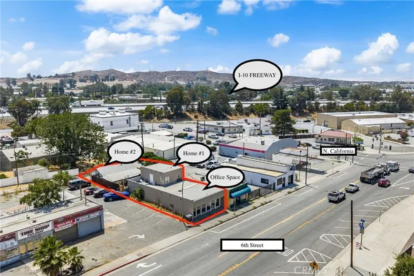 a view of a swimming pool with outdoor seating and plants