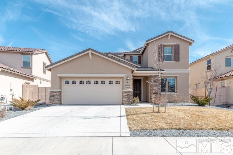 10602 Washington Reno, NV 89521 - Photo 1 of 25 a front view of a house with a yard
